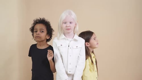 Three Cute Children Standing Together Indoors