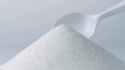 White spoon scoops up sugar, Slow Motion