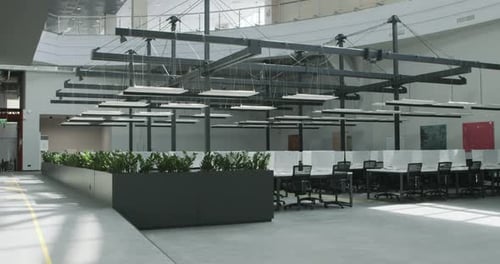 Modern Workplace with Conference Zone and Covered Computers