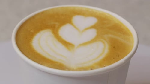 Heart Latte Art in a White Paper Cup