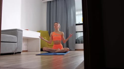 Woman Meditating in Bright Home Interior