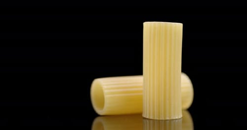 Close Up of Two Pieces of Rigatoni Pasta