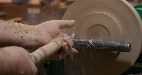 Wood Turner Shaping Wood on Lathe Close Up