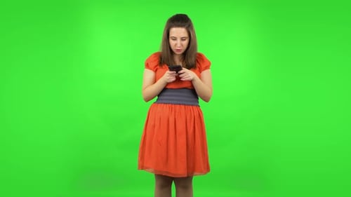 Cute Girl Texting on Her Phone