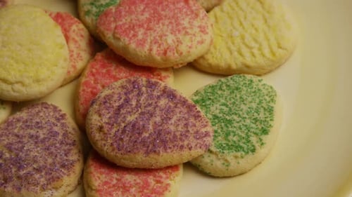 Festive Sugar Cookies with Colorful Sprinkles on Plate