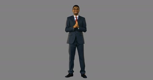 Smiling Man Standing in a Suit