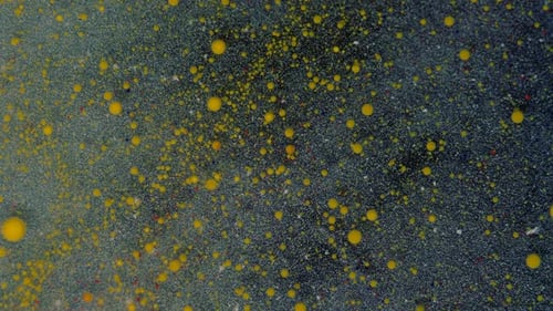 Rounded Red Yellow Particles on a Bluewhite Background with Sequins