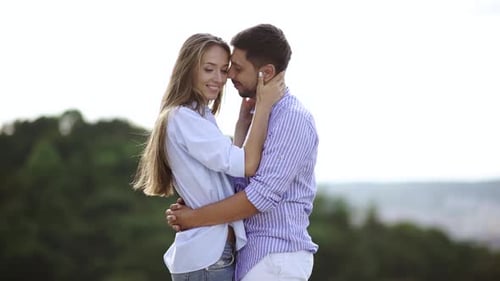 Affectionate Couple Embracing Outdoors in Natural Setting