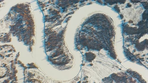 Beautiful Snowy White Forest And Curved Frozen Snow Covered River In Winter Frosty Day