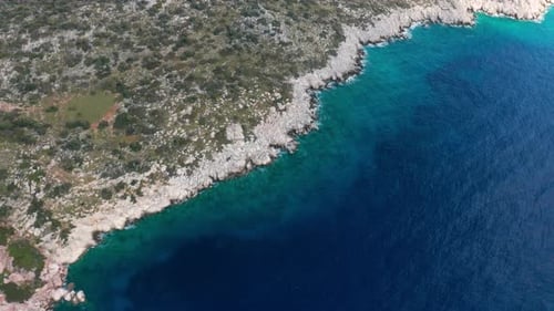 Aerial View of Clear Turquoise Water Near the Rocky Coast of the Aegean Sea