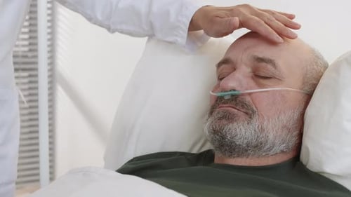 Senior Man Sleeping Peacefully in Hospital Bed
