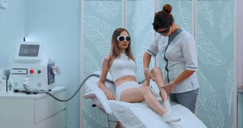 Woman Getting Laser Hair Removal Treatment in Clinic