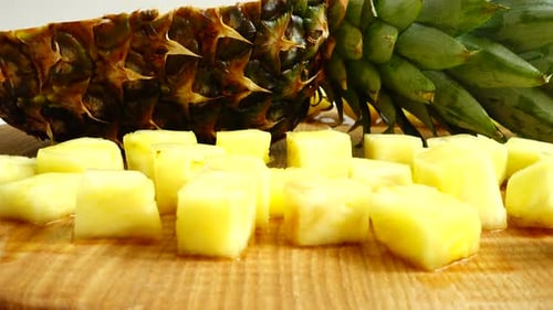Close Up of Pineapple Slices and Halved Fruit