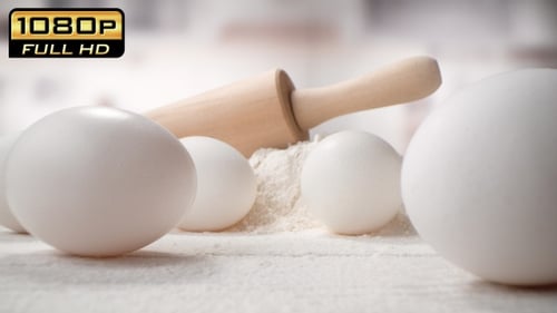 Baking Ingredients and Tools Laying on Pastry Board