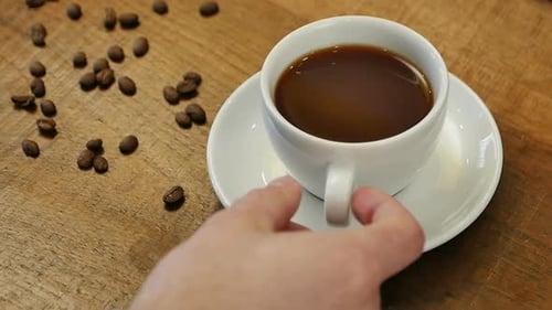 Close Up of Cup of Coffee on Wooden Table