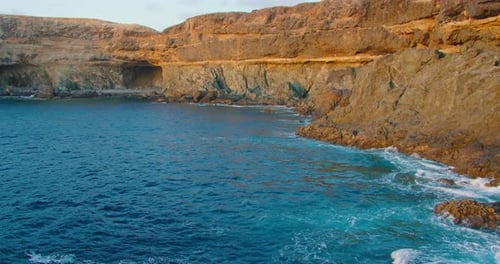 Rock Caves Coast Beach Blue Ocean Water on Beautiful Island in Fuerteventura