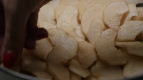 Tasty apple pie detailed preparation close-up 4K 2160p 30fps UltraHD footage - Arranging fruit piece