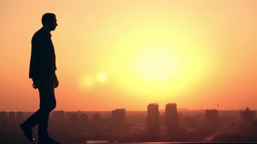 Man Walks at Sunrise Outdoors