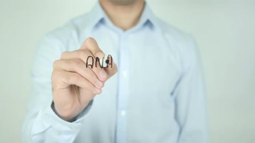 Hand Writes Analytical Report on Clear Surface