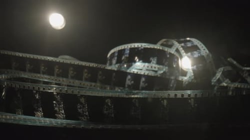 Dramatic Film Reel Illuminated in Dark