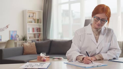 Doctor Filling Medical Record on Session