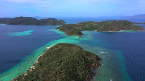 Panorama of Tropical Islands Surrounded By Turquoise Sea. Camera Move Down. Aerial View