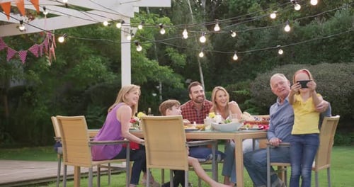Family Celebrates Outdoors in a Backyard Gathering