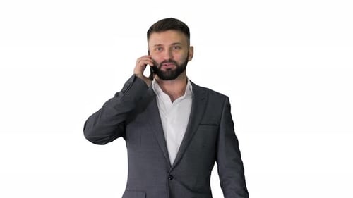 Man in Suit Talking on Smartphone While Walking