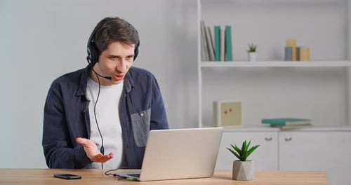 Man Talking on Video Call with Headset