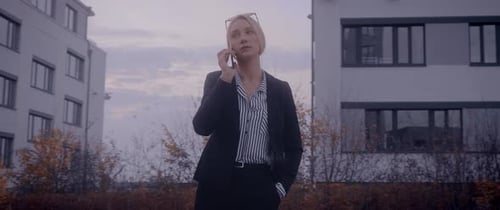 Business Woman Talking on Phone Outside Office