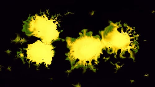 Abstract Yellow Ink Splatters on Black Background
