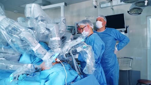 Surgeons Using Robotic Arms for Precision Operation