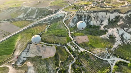 Hot Air Balloons Fly Over the Mountainous Landscape of Cappadocia Turkey