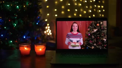 Woman on Laptop Screen with Christmas Gifts