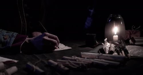 Writer Working at Candle Lit Desk with Quill