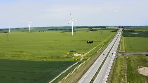 Aerial View of Wind Turbines and Highway