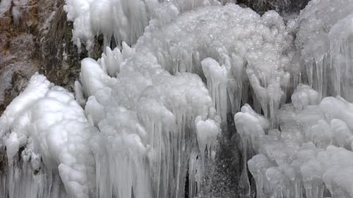 Frozen Waterfall in Winter Landscape