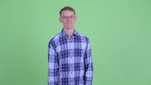 Man Gives OK Sign on Green Screen Background