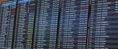 Departure arrival board with timetable and schedule in airport terminal.