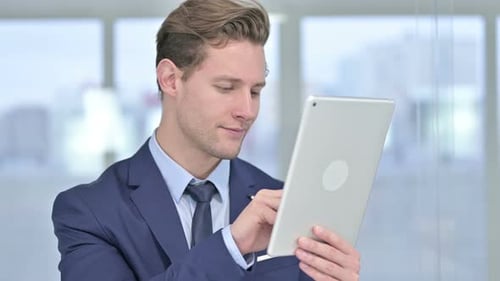 Man Using Tablet at the Workplace