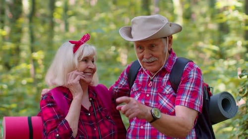 Senior Couple Laughing Together on Wooded Hike