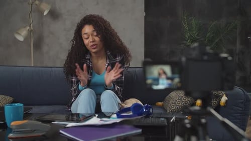 Young Woman Vlogging on Camera Indoors