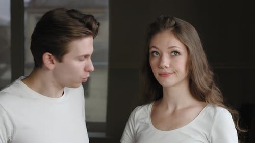 Young Couple Talking Indoors
