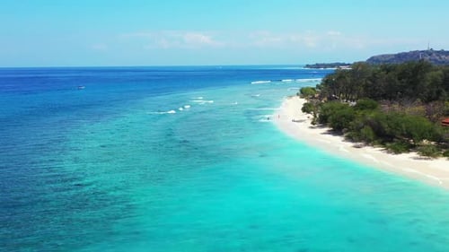 Aerial drone abstract of tranquil seashore beach adventure by blue sea with white sandy background o