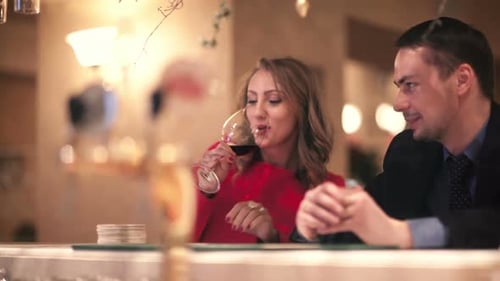 Man and woman at the bar counter