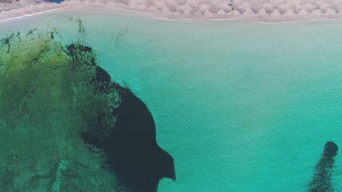 Transparent sea water near stony remote coast