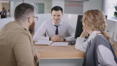 Business Meeting Between Man, Woman and Salesperson