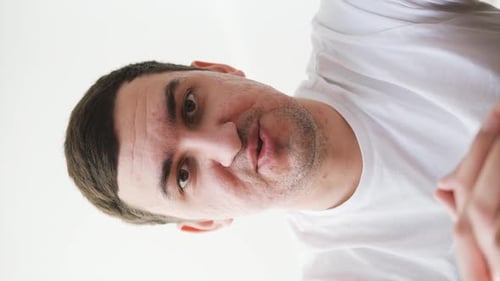 Young Adult Man Looking Down, Close Up