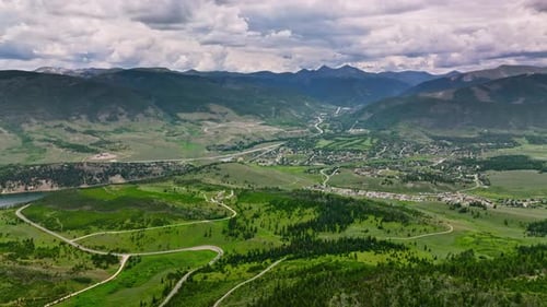Aerial View of Green Trees in Forest Against Mountains