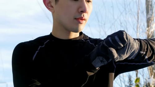 Athlete Uses Smartwatch in Snowy Outdoor Setting